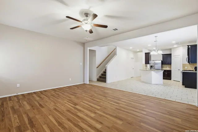 a view of a kitchen with a sink and cabinet