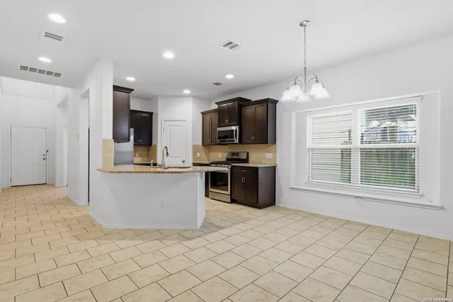 a large kitchen with cabinets