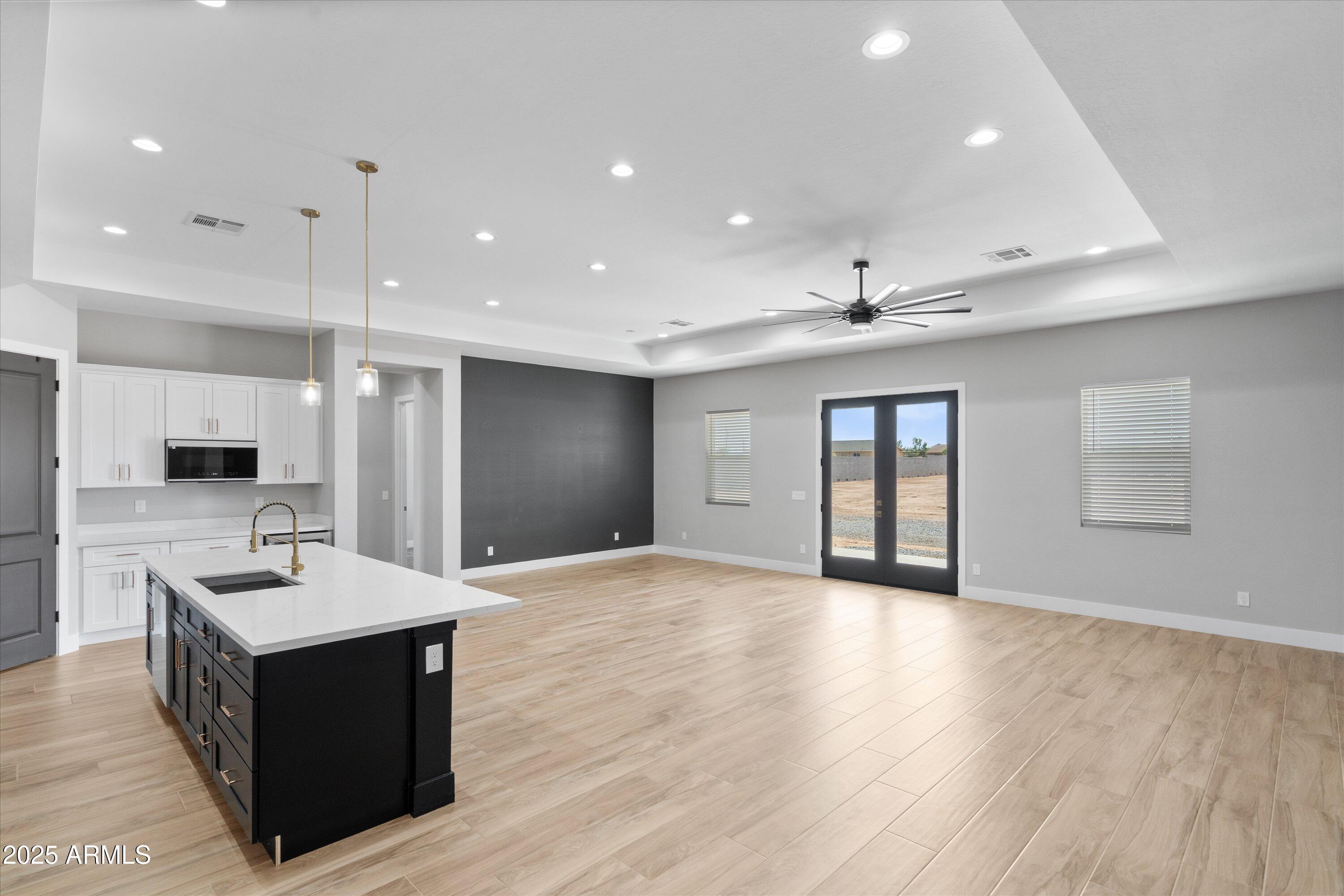 20765 West Cheyenne Road Buckeye, AZ 85326 - Photo 15 of 54 15-Kitchen to Dining and Family