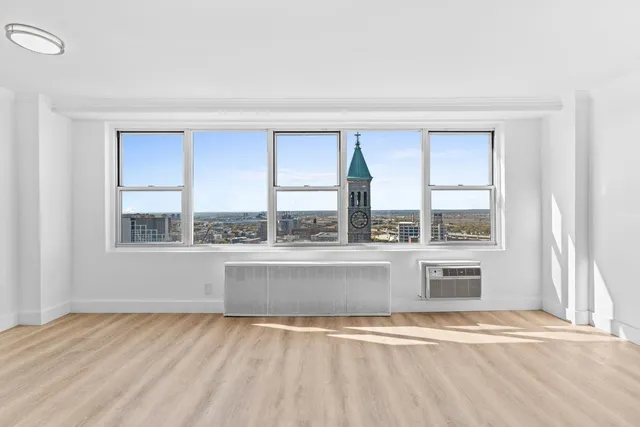 a view of a living room with a large window
