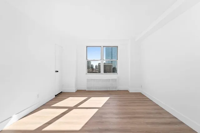 a view of an empty room and window