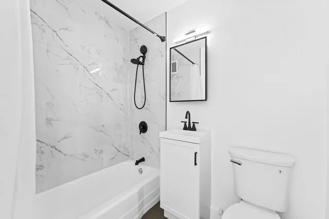 a bathroom with a sink a toilet and a bathtub