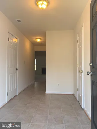 an empty room with entrance door