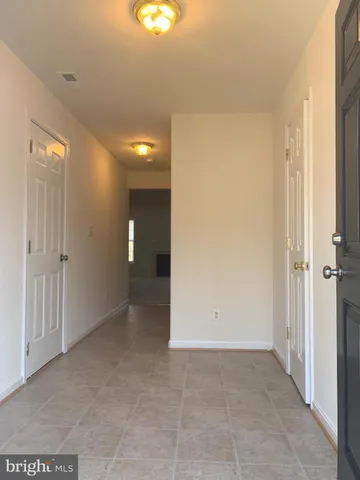 an empty room with entrance door