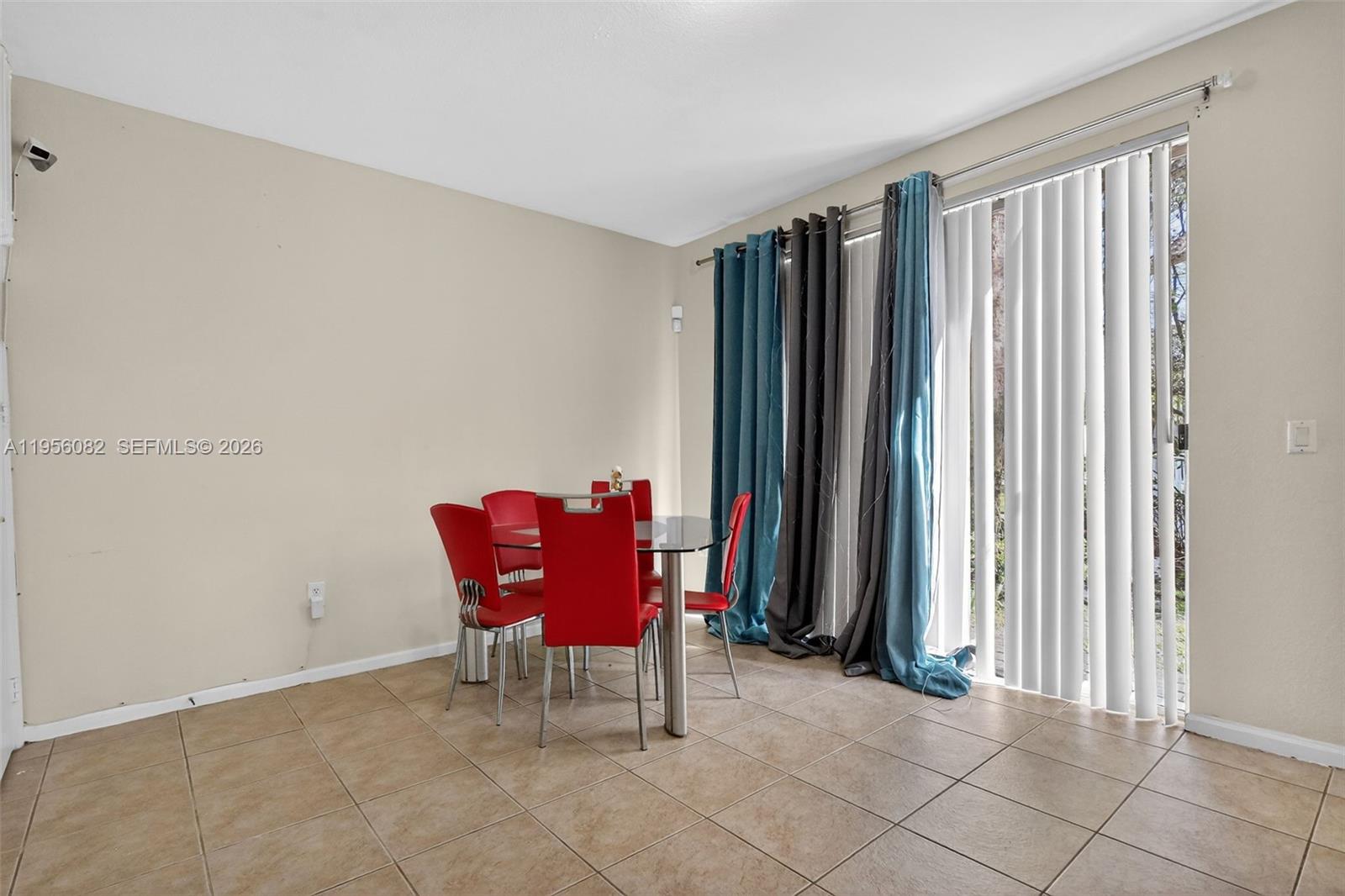 2671 Southwest 85th Terrace, Unit 103 Miramar, FL 33025 - Photo 12 of 49 a view of a room with furniture and a window