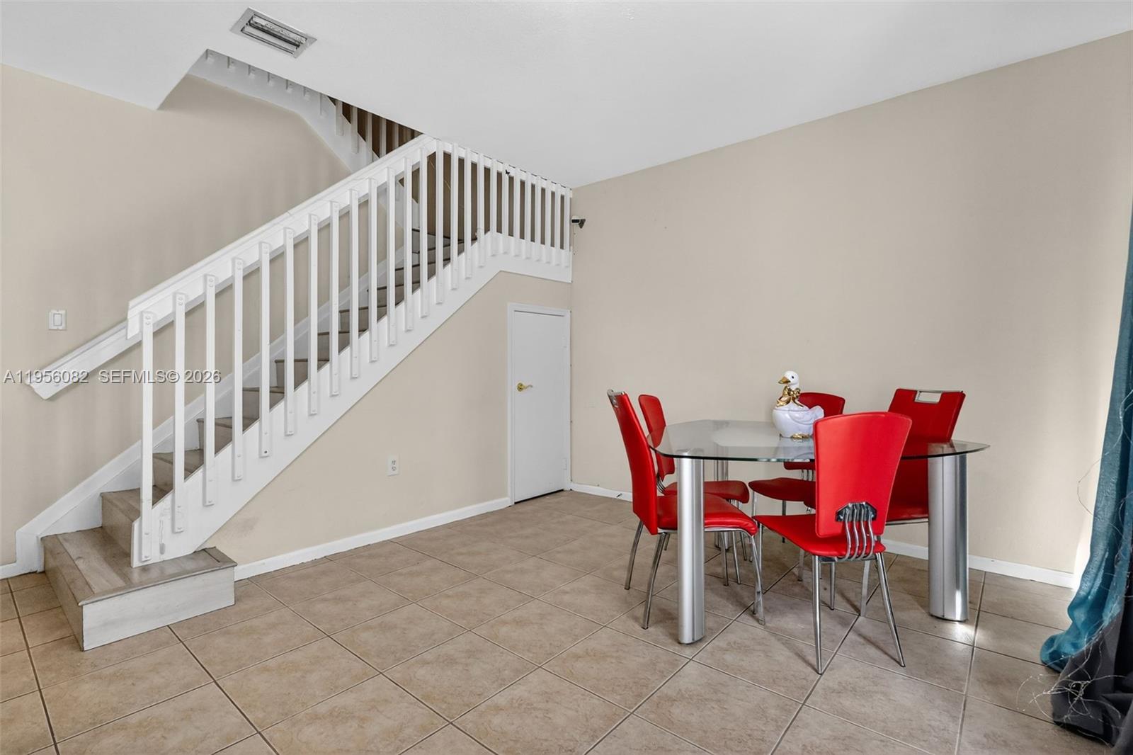 2671 Southwest 85th Terrace, Unit 103 Miramar, FL 33025 - Photo 13 of 49 a view of a dining room with furniture a rug and wooden floor