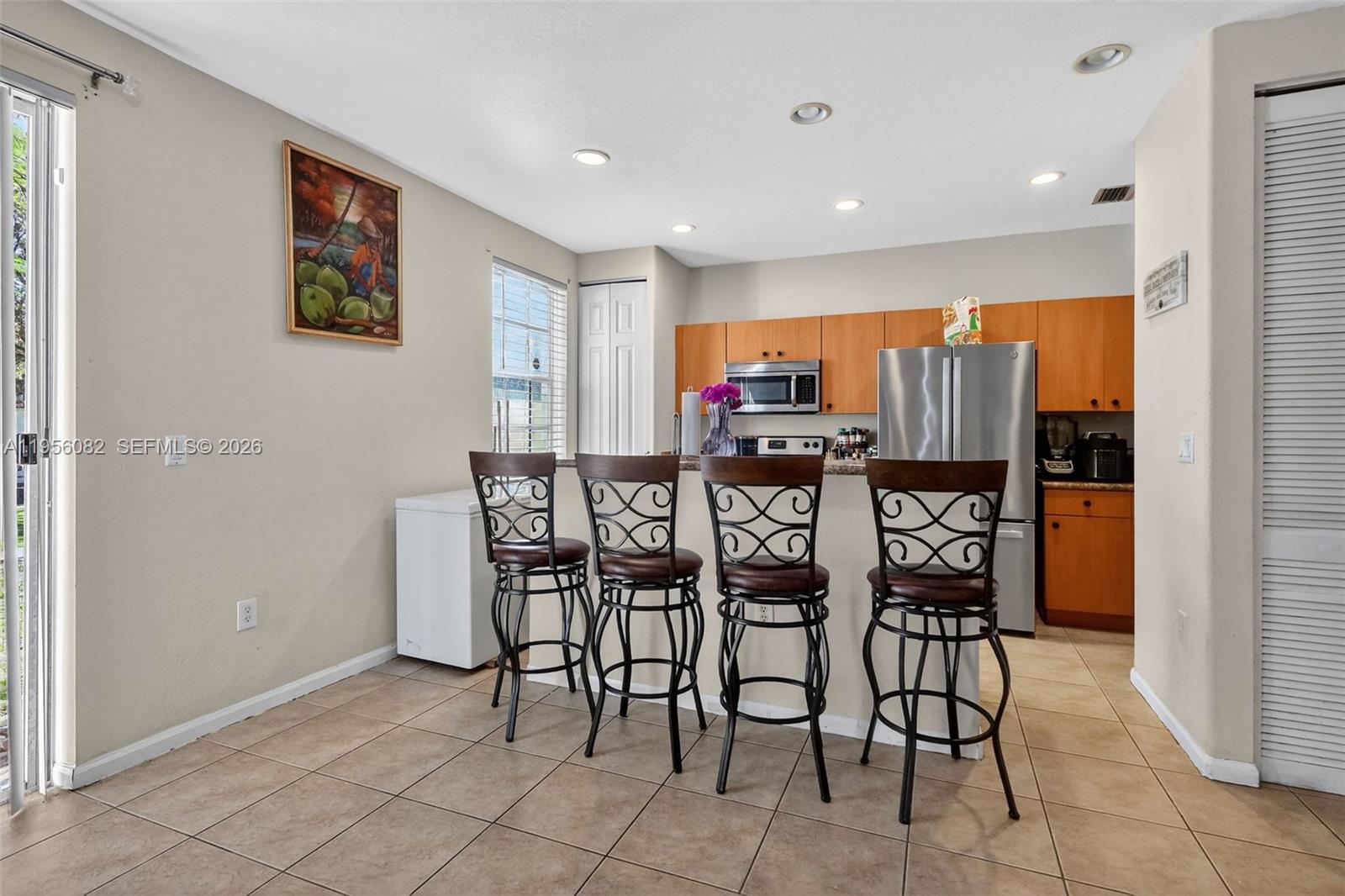 2671 Southwest 85th Terrace, Unit 103 Miramar, FL 33025 - Photo 15 of 49 a view of a dining room with furniture