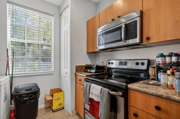 a kitchen with a stove and a microwave