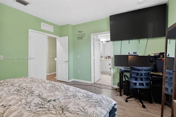 a bedroom with a bed and furniture