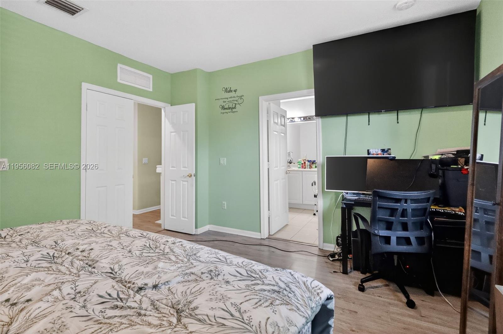 2671 Southwest 85th Terrace, Unit 103 Miramar, FL 33025 - Photo 25 of 49 a bedroom with a bed and furniture