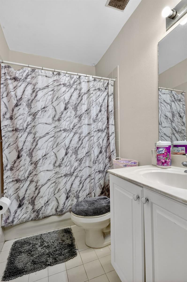 2671 Southwest 85th Terrace, Unit 103 Miramar, FL 33025 - Photo 32 of 49 a bathroom with a sink and a toilet