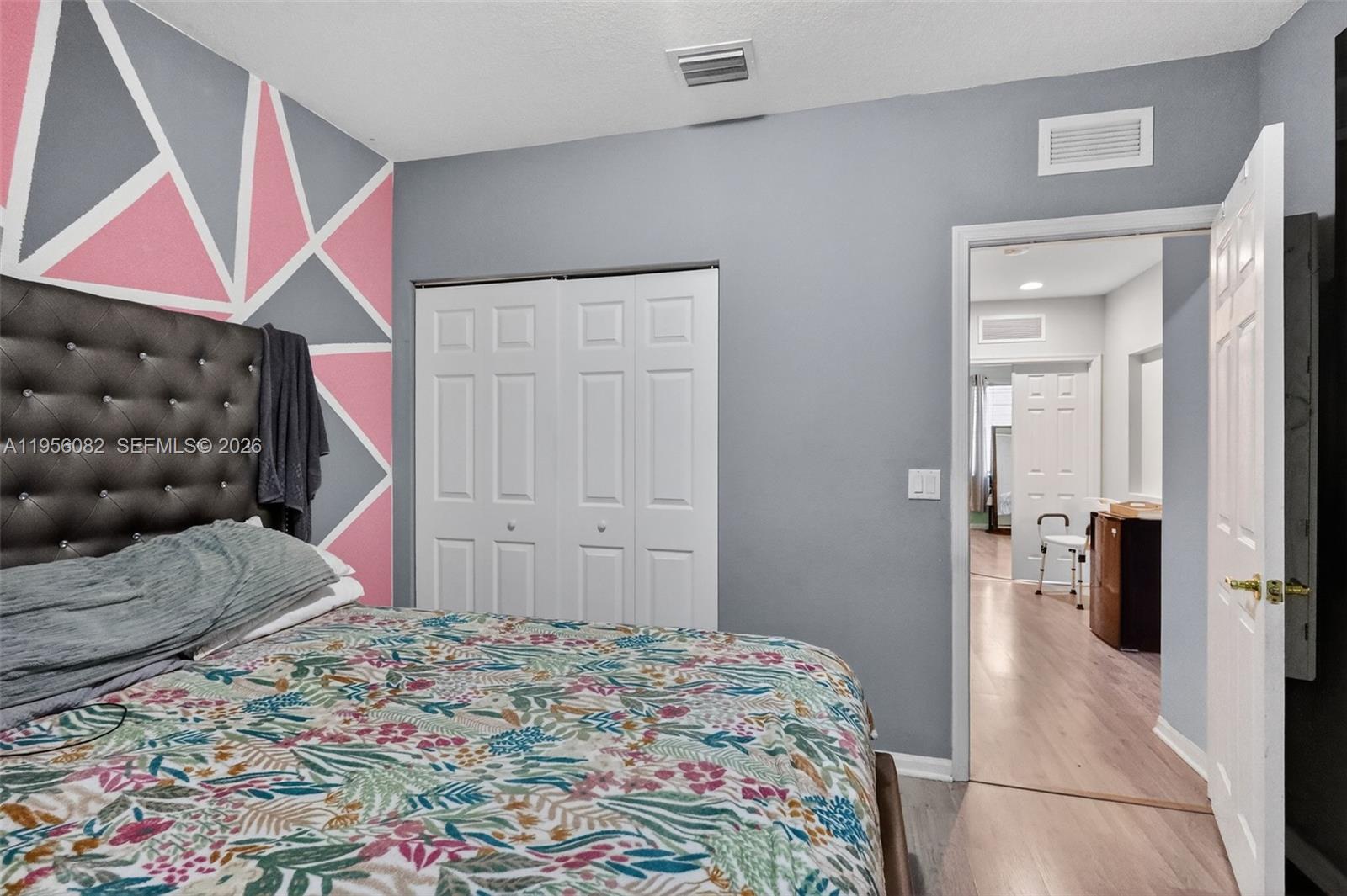 2671 Southwest 85th Terrace, Unit 103 Miramar, FL 33025 - Photo 35 of 49 a bedroom with a bed and a walk in closet