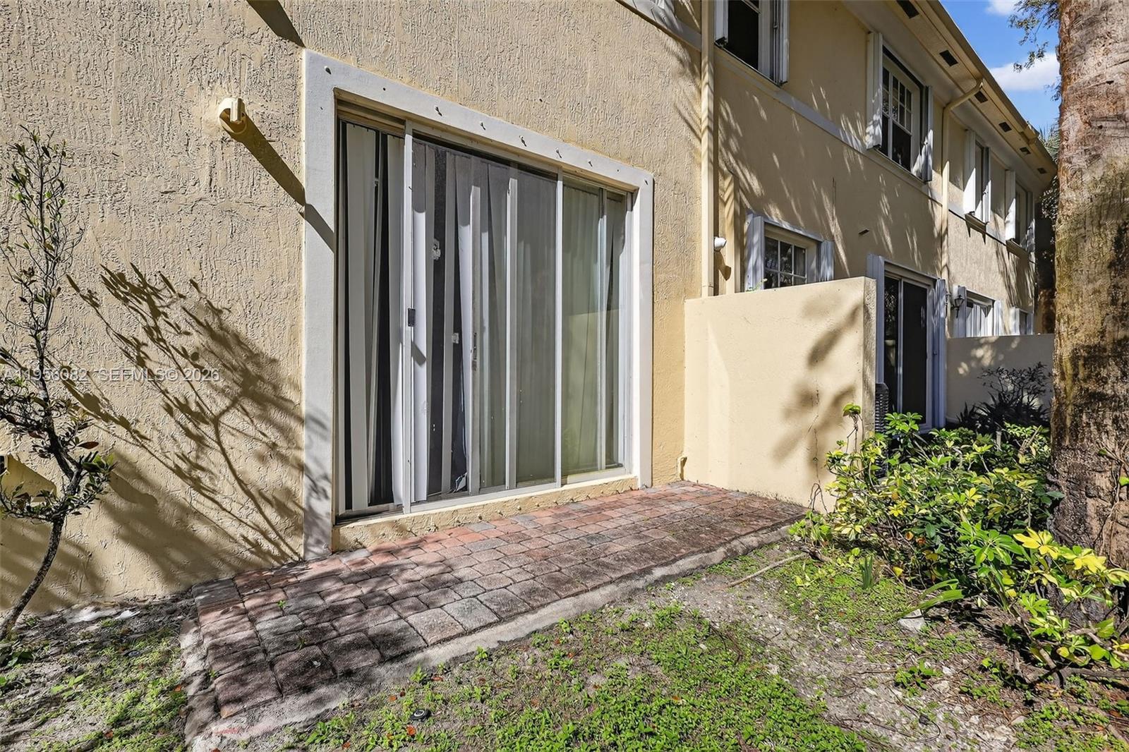 2671 Southwest 85th Terrace, Unit 103 Miramar, FL 33025 - Photo 43 of 49 a view of a house with a yard