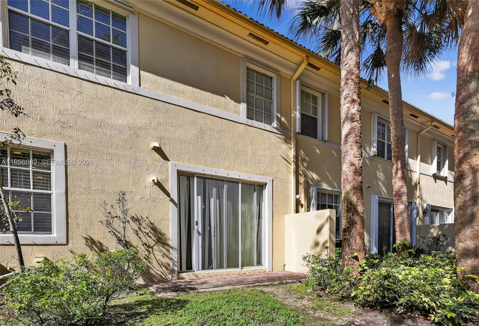 2671 Southwest 85th Terrace, Unit 103 Miramar, FL 33025 - Photo 45 of 49 a view of a house with a yard