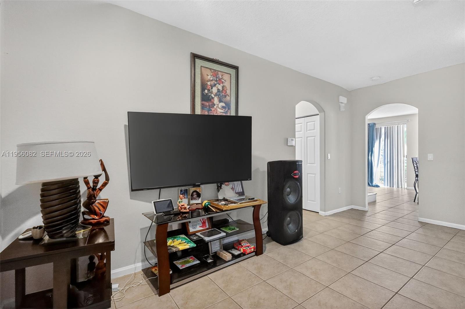 2671 Southwest 85th Terrace, Unit 103 Miramar, FL 33025 - Photo 5 of 49 a room with furniture and a flat screen tv