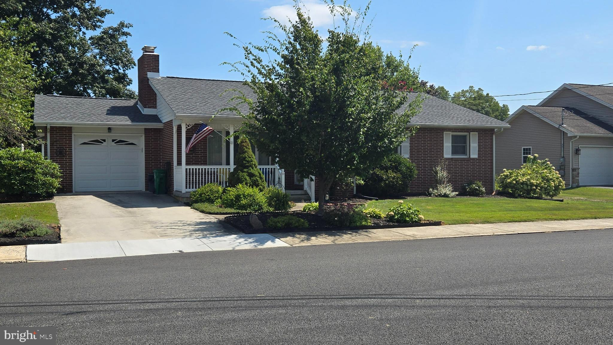 105 Media Road Carlisle, PA 17013 - Photo 3 of 7 Charming home with lush greenery and curb appeal.