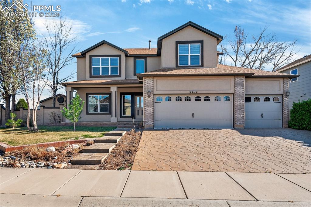 7763 Middle Bay Way Fountain, CO 80817 - Photo 1 of 44 a front view of a house with a yard