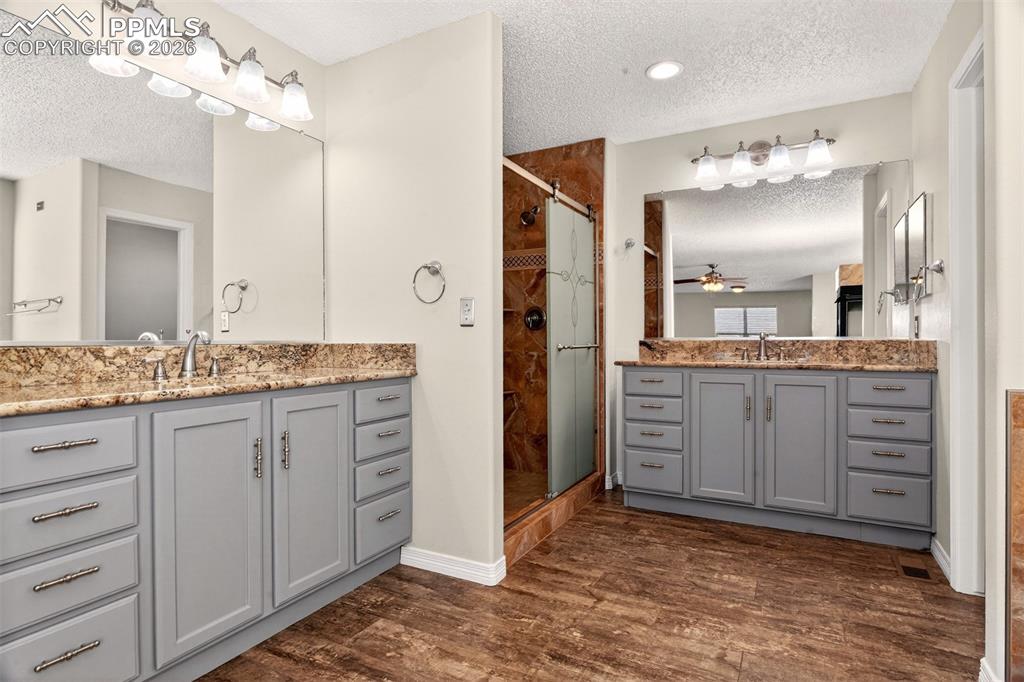 7763 Middle Bay Way Fountain, CO 80817 - Photo 20 of 44 a spacious bathroom with a granite countertop sink mirror and a