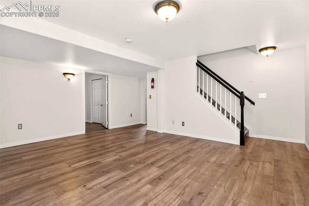 7763 Middle Bay Way Fountain, CO 80817 - Photo 28 of 44 a view of room with wooden floor