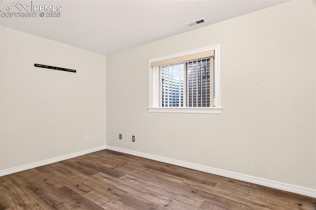 7763 Middle Bay Way Fountain, CO 80817 - Photo 34 of 44 a view of a room that has wooden floor and window