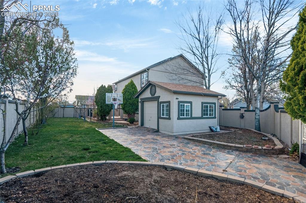 7763 Middle Bay Way Fountain, CO 80817 - Photo 43 of 44 a view of a house with a yard