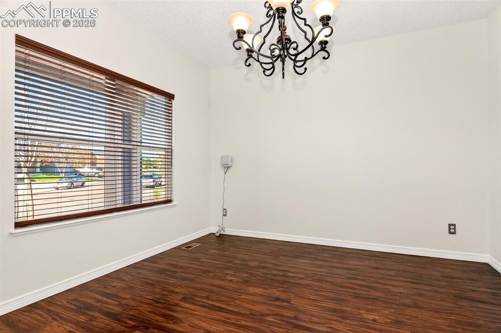 7763 Middle Bay Way Fountain, CO 80817 - Photo 5 of 44 a view of a room with wooden floor and a window
