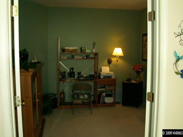 9709 Ripple Way Reno, NV 89521 - Photo 4 of 9 a room with furniture and a lamp
