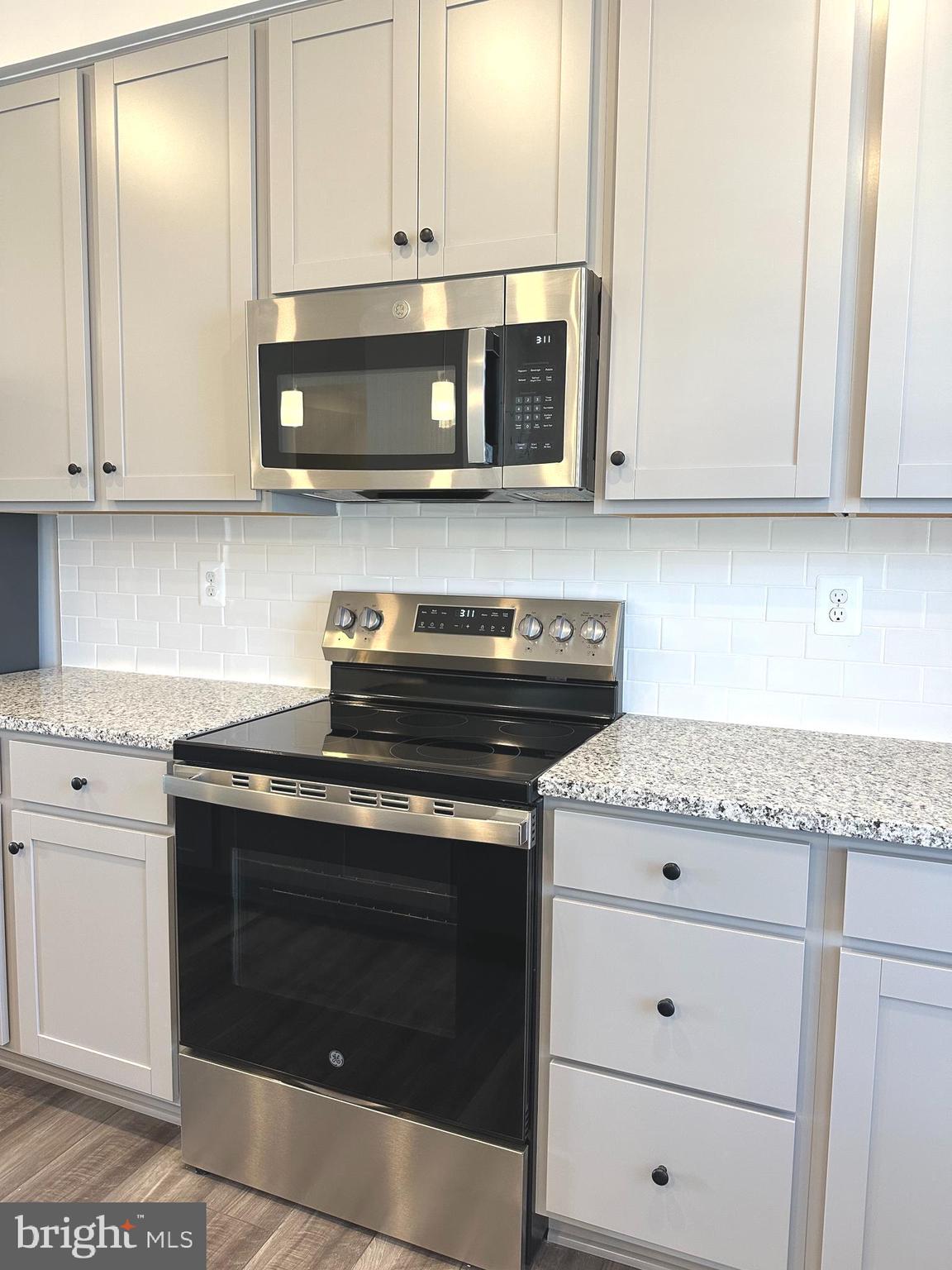 78 Rolling Branch Drive Ranson, WV 25438 - Photo 11 of 49 a stove top oven sitting inside of a kitchen