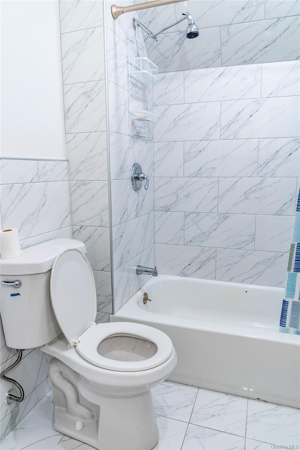 283 Chestnut Street Liberty, NY 12754 - Photo 17 of 22 a bathroom with a toilet a sink and bathtub