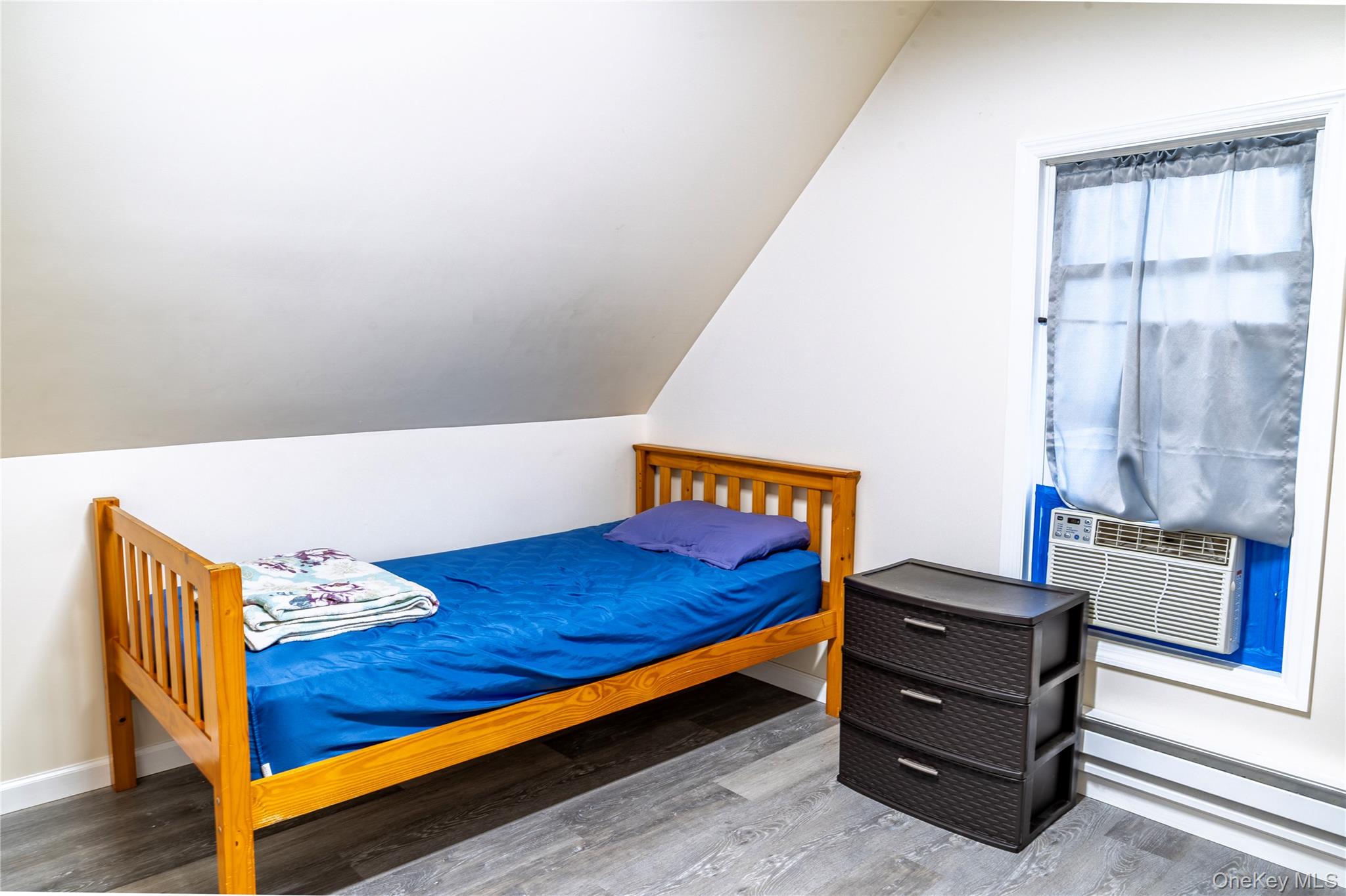 283 Chestnut Street Liberty, NY 12754 - Photo 18 of 22 a bed room with a bed and a window