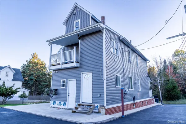a front view of a house with a balcony