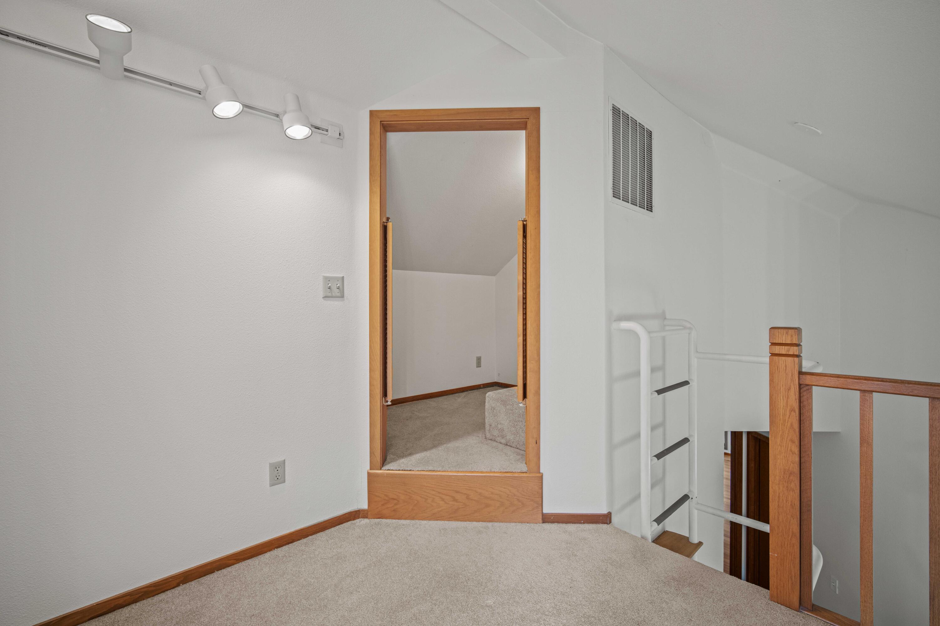 17674 Bittern Lane, Unit 7 Sunriver, OR 97707 - Photo 34 of 43 Upper loft looking into the walk-in closet/storage space.
