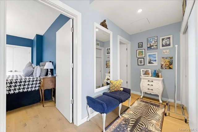 a bedroom with furniture and a window