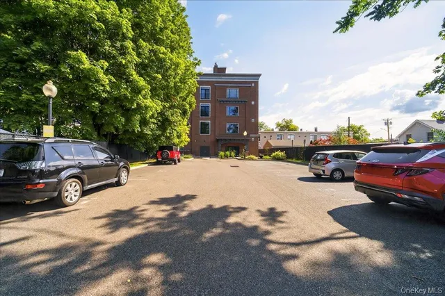 a view of street with parked cars