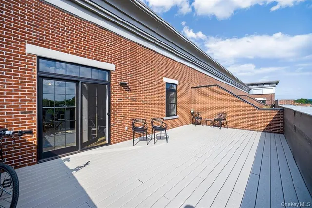 a view of balcony with furniture