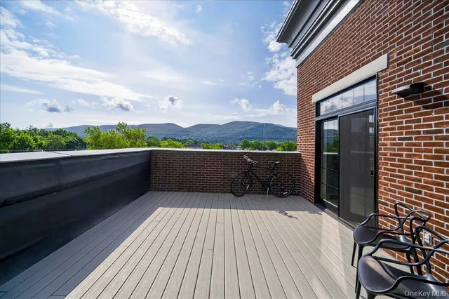 a view of balcony with furniture