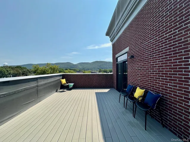 a view of balcony and deck with wooden floor