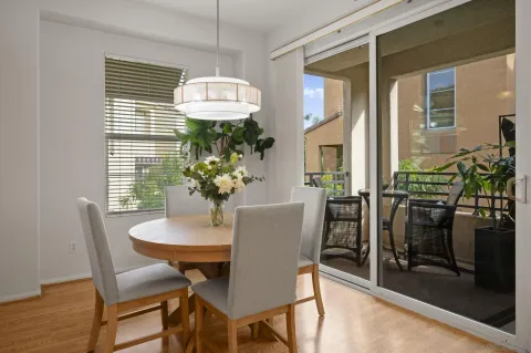 a view of a dining room with furniture and a window