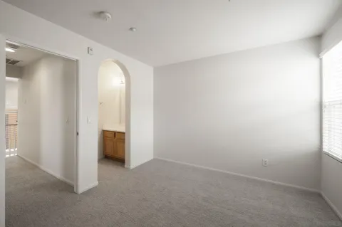 an empty room with a bathroom