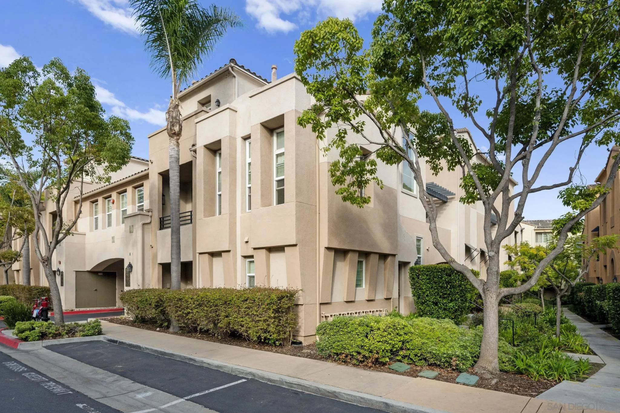 2847 Escala Circle San Diego, CA 92108 - Photo 29 of 35 a view of a white building among the street with palm trees