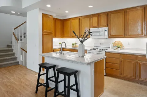 a kitchen with a sink cabinets and window