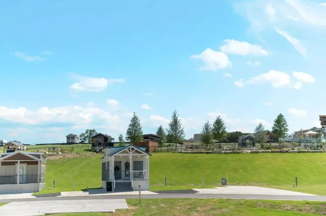 a front view of a house with a lake view