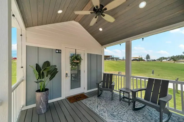 a view of a living room and balcony