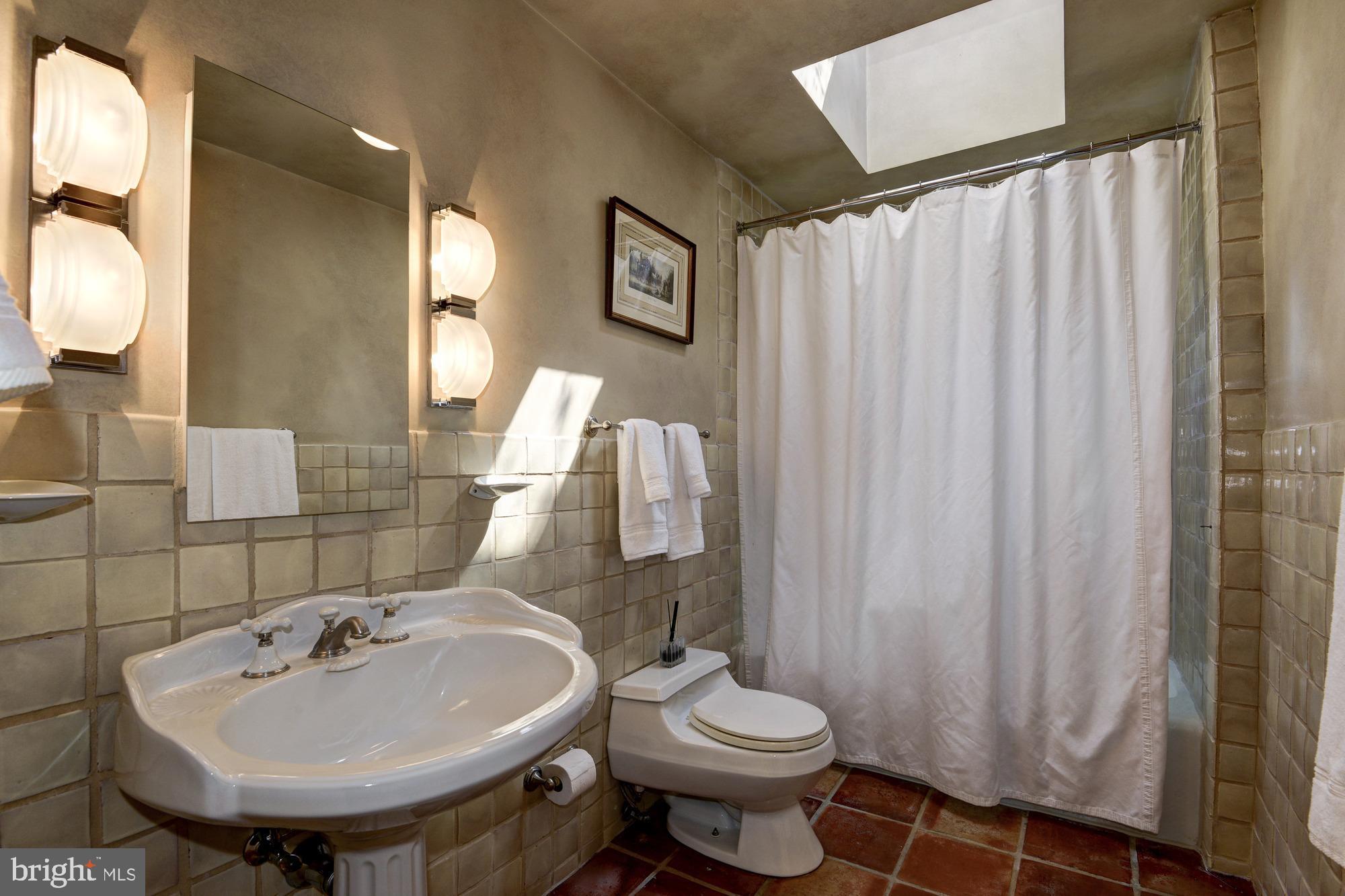 3249 O Street Northwest Washington, DC 20007 - Photo 12 of 24 a bathroom with a sink a toilet and a mirror