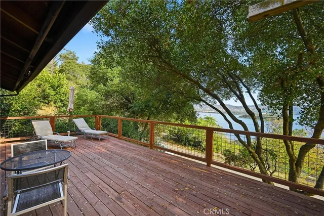 a view of a deck with wooden floor and outdoor seating
