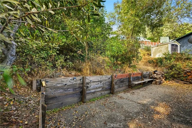 a backyard of a house with outdoor seating