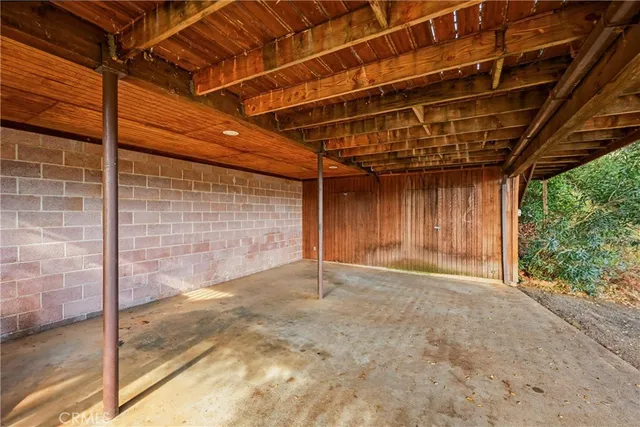 a view of a room with wooden walls