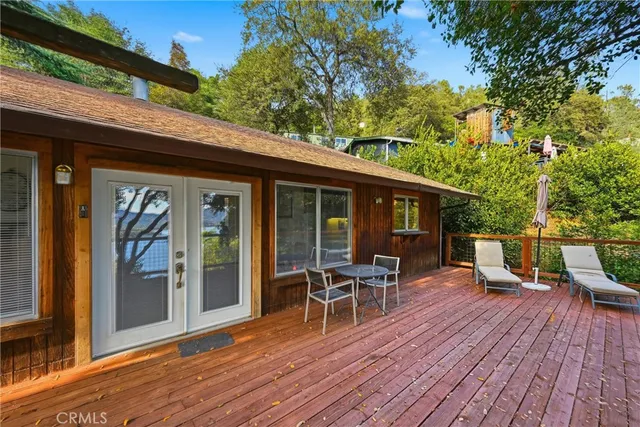 a view of a house with chairs and table in patio