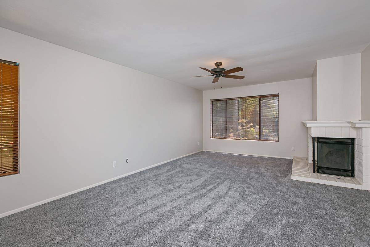 4031 Grayson Drive San Diego, CA 92130 - Photo 18 of 25 an empty room with windows and fireplace