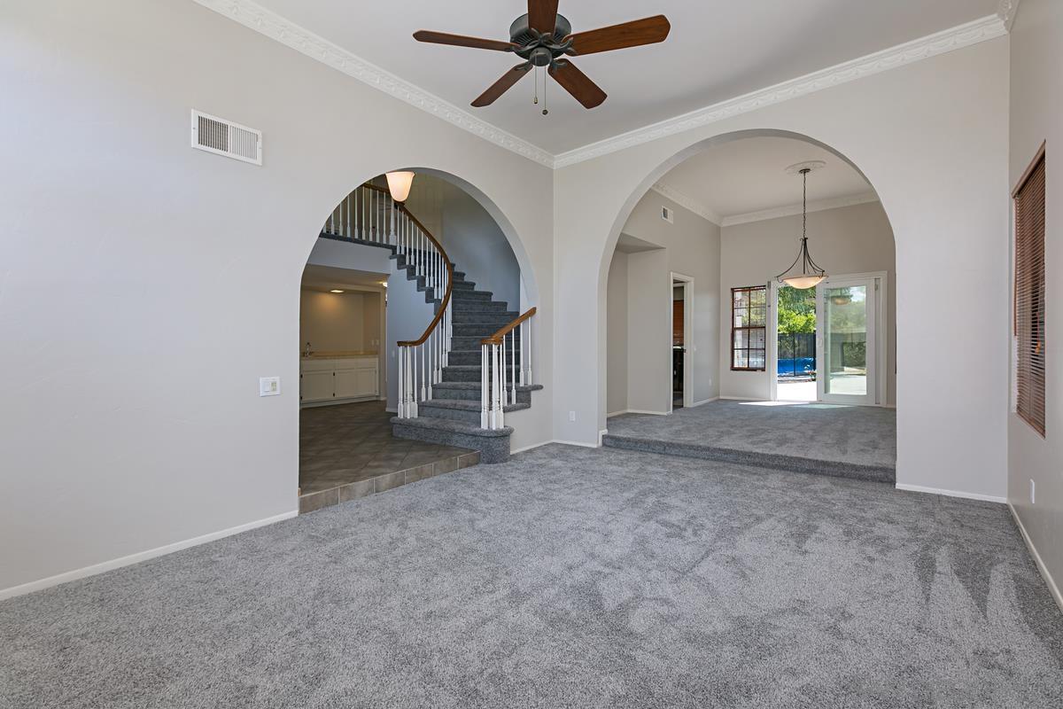 4031 Grayson Drive San Diego, CA 92130 - Photo 7 of 25 an empty room with fan and windows